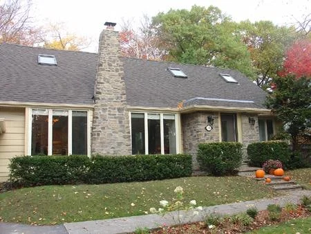 Manufactured veneer on a house facade and chimney