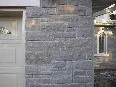 Rectangular Melo building stone blocks beside an entrance