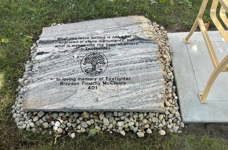 Custom engraved memorial stone with lettering and a tree emblem, created and supplied by Allstone