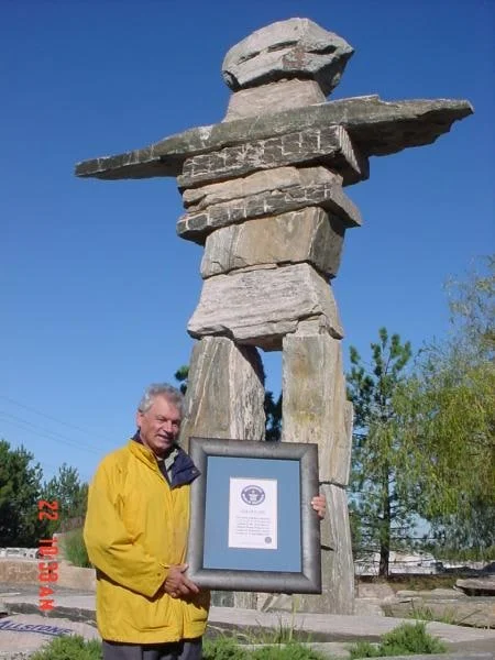 Jose Melo holding his Guinness World Records certificate beside Little Joe