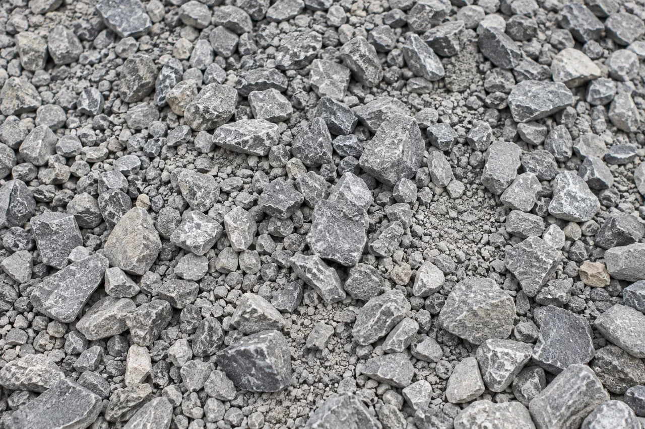 Mixed-size angular grey crushed limestone with fine particles