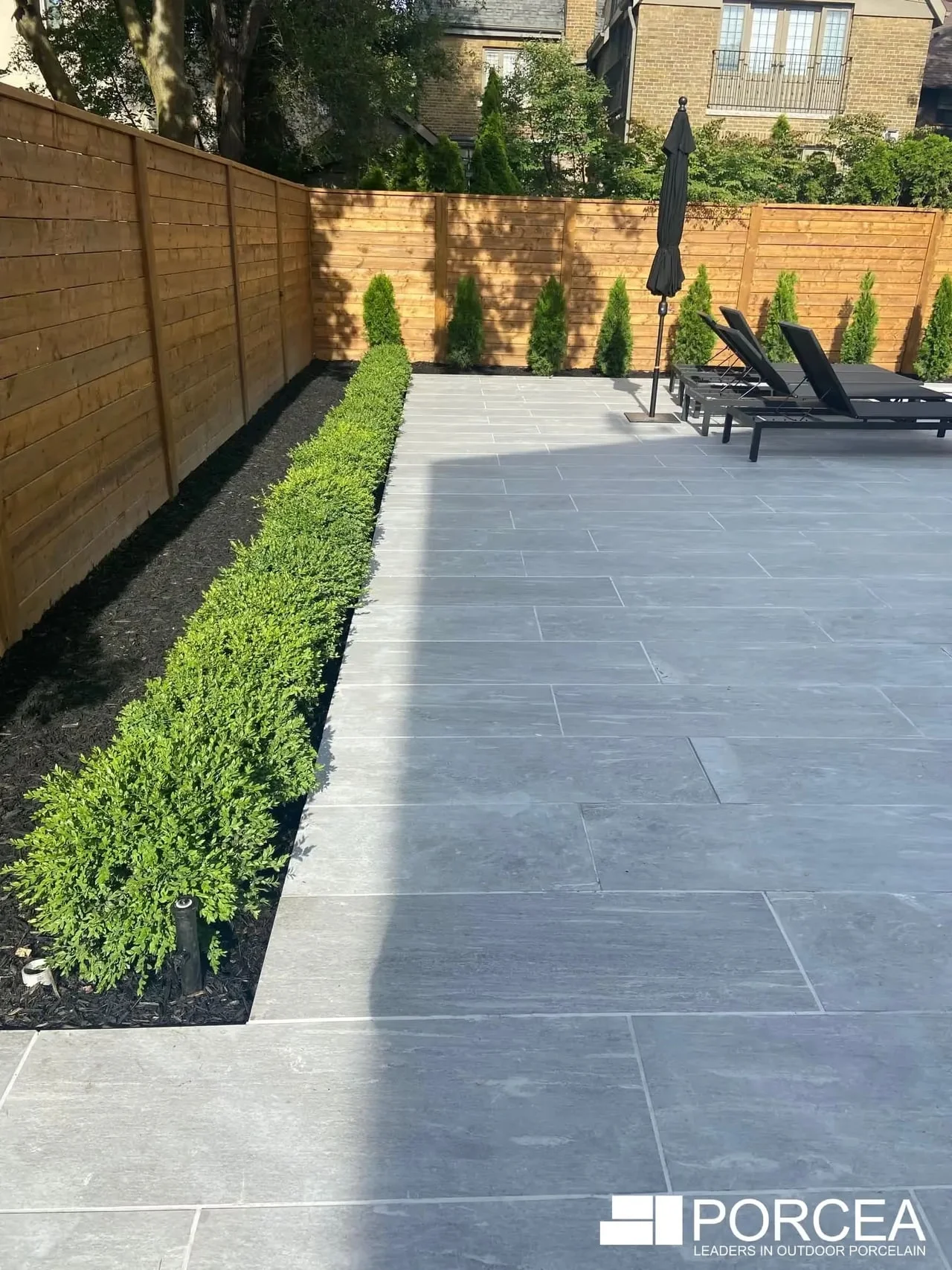 Porcea Greige porcelain paving beside garden planting at a Vaughan residence, from Porcea Stone’s official gallery